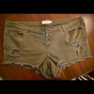 Torrid size 26 Jean short shorts. Faded,dark green, distressed jean shorts.